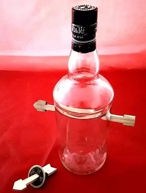 Arrow Through Bottle and Coin - Click Image to Close
